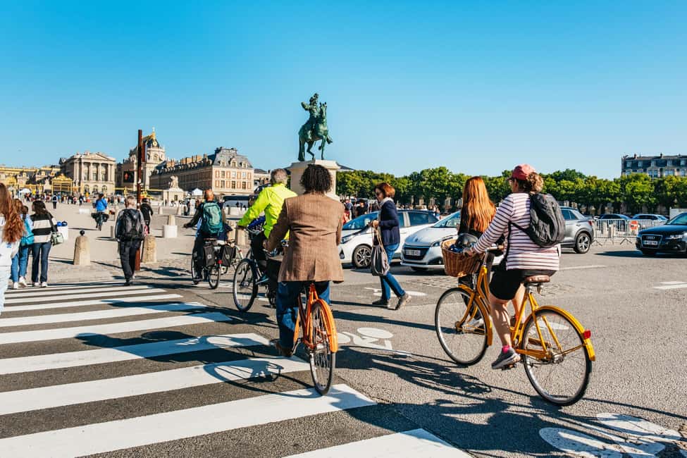 From Paris: Skip-the-Line Palace of Versailles Bike Tour - Versailles town break: the market, cheese tasting, and snack shopping