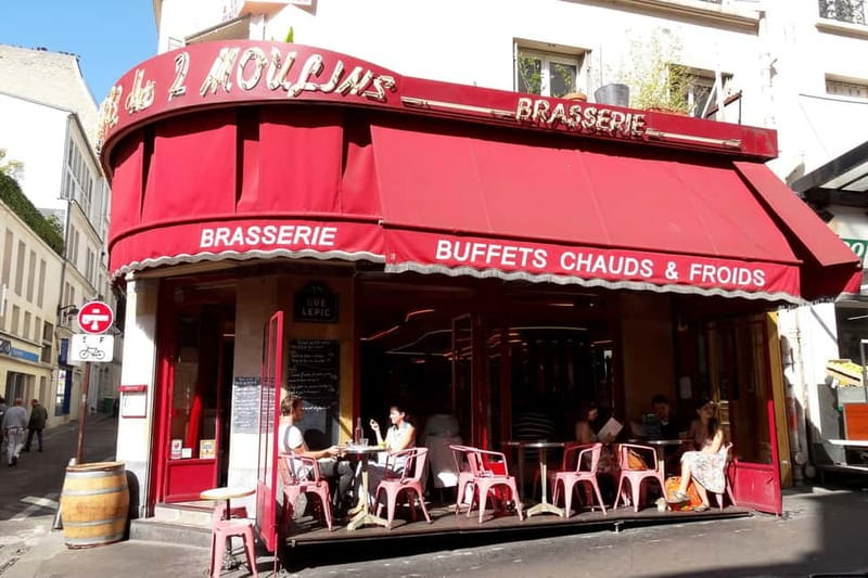 German private Walking Tour through Montmartre & Passages - Starting at Pl. Blanche: your first landmark is the mood