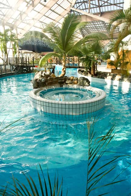 Paris: Aquaboulevard Water Park Entrance Ticket - Slides, wave pools, jacuzzis, and the sandy-beach break