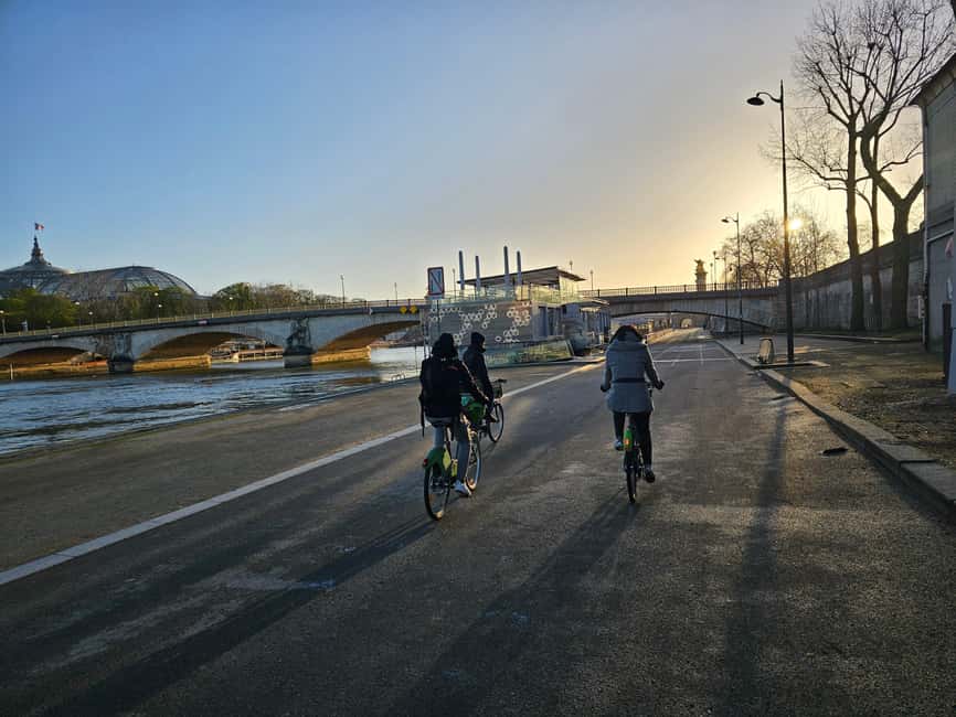 Paris Before the Crowds: Sunrise Bike Tour with Breakfast - Riding through Paris calm: bikes, group size, and street confidence