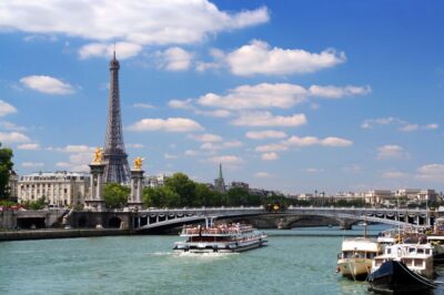 Paris: Eiffel Tower Tour & Seine River Cruise Tour - The guided walk and the Dame de Fer story at street level