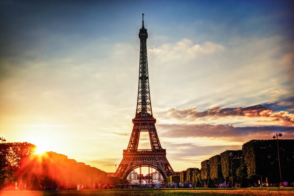 Paris: Evening Sightseeing Tour and Moulin Rouge Show - The Féérie show: Doris Girls, can-can roots, and giant spectacle energy
