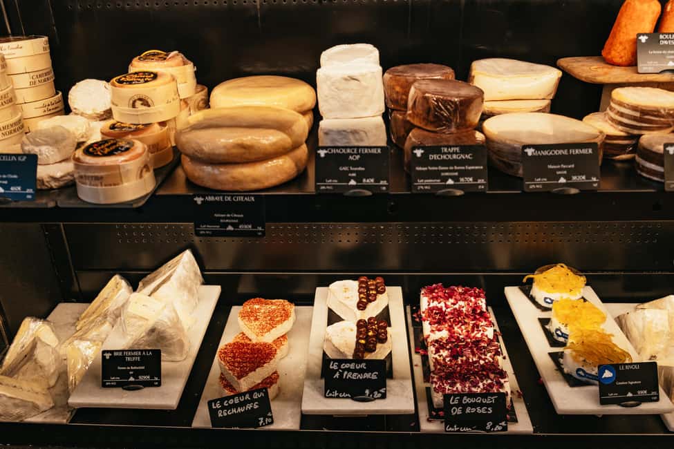 Paris: Gourmet Food Tour with Over 10 Tastings and Wine - The wine bar pairing: cheese and charcuterie plus two glasses