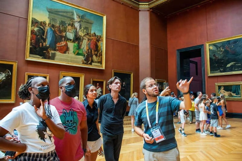 Paris: Louvre Museum Highlights Small-Group Guided Tour - Meeting the guide: the horse statue by the pyramid