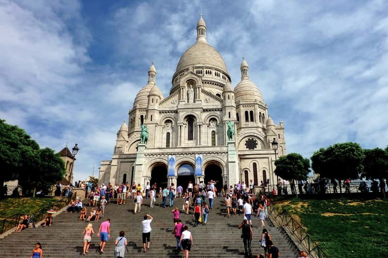Paris: Montmartre Hidden Gems and Highlights Walking Tour - Place du Tertre: artists, terraces, and the real Montmartre scene